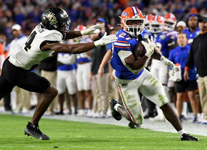 Dec 23, 2021; Tampa, FL, USA; Florida Gators running back Dameon Pierce (27) runs the ball against the UCF Knights in the first half of the Gasparilla Bowl at Raymond James Stadium. Mandatory Credit: Jonathan Dyer-USA TODAY Sports
